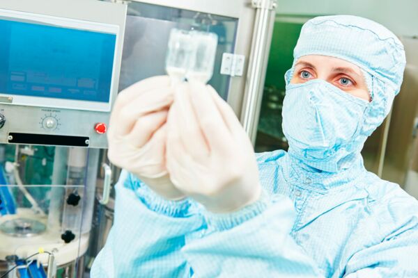 MEGLA: A woman in the laboratory examining a drug